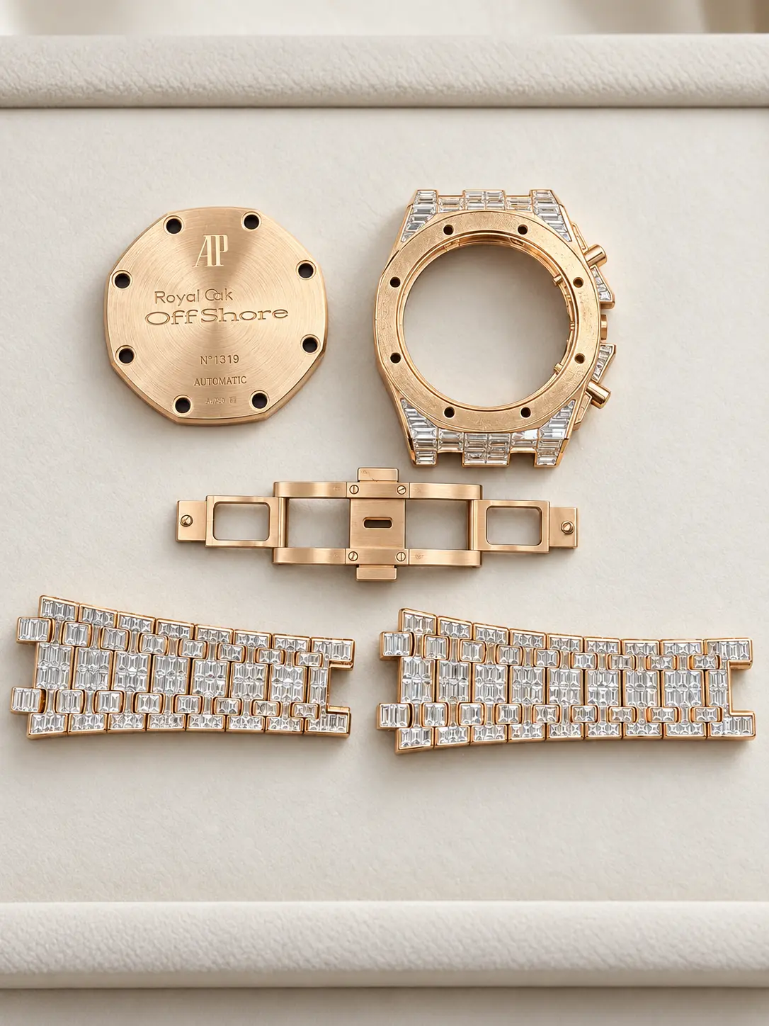 Octagonal rose gold case and baguette-diamond bracelet separated for service