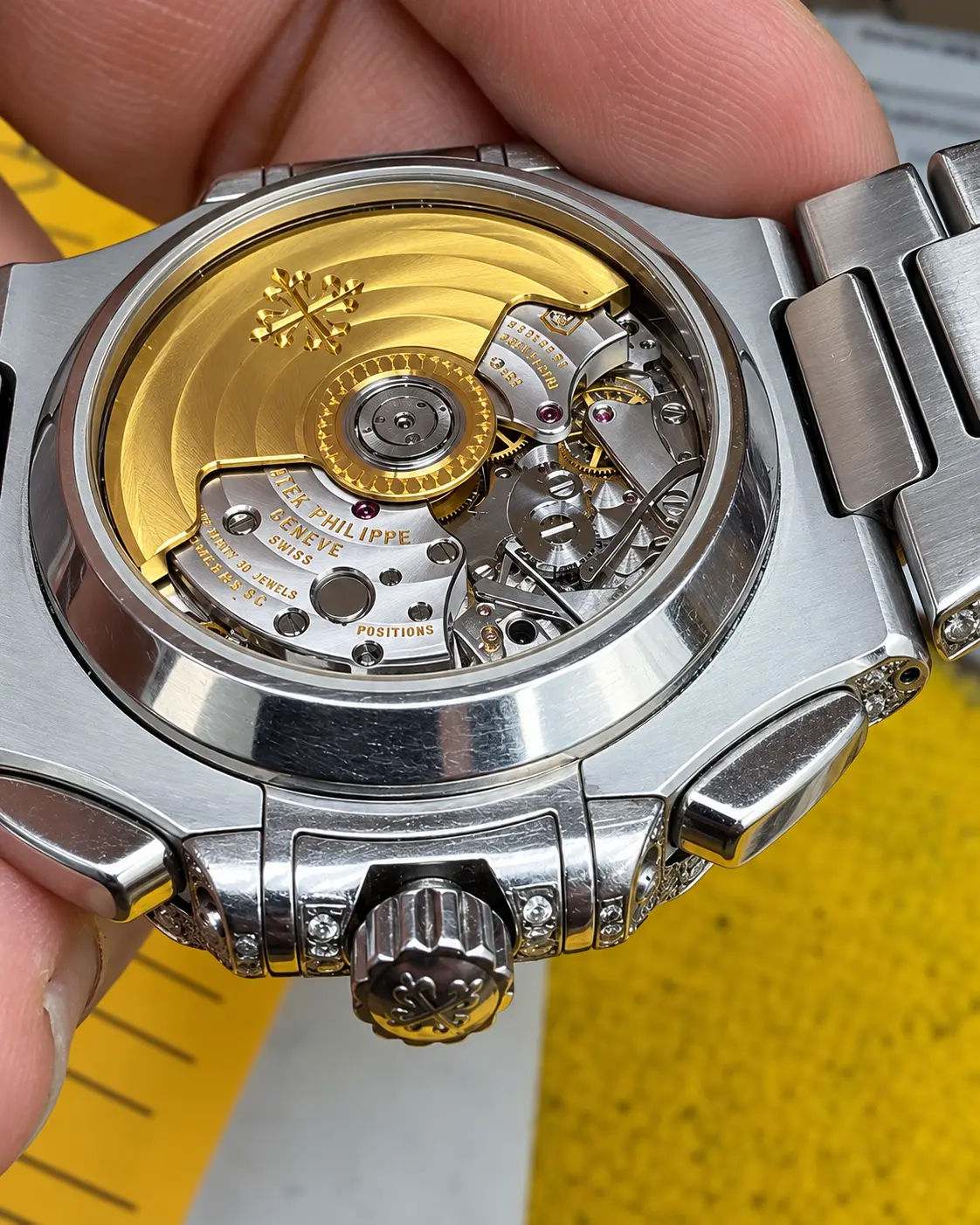 Gold-rotor movement seen through an exhibition caseback