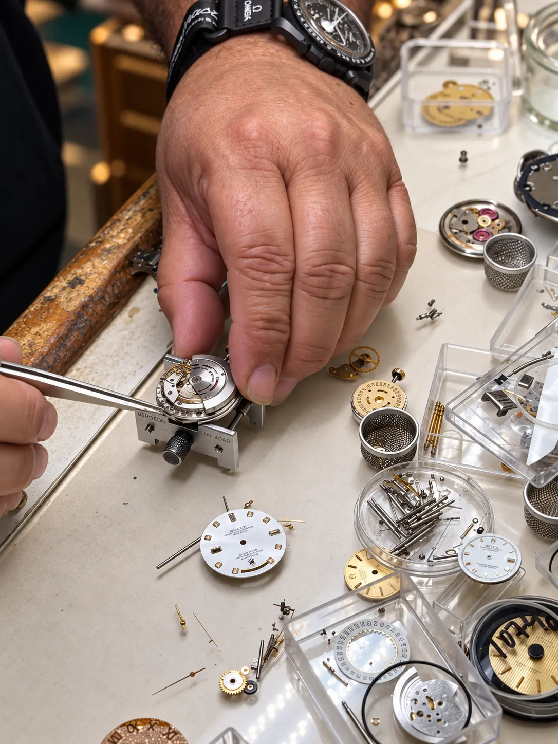 Movement in a bench holder surrounded by dials and parts trays
